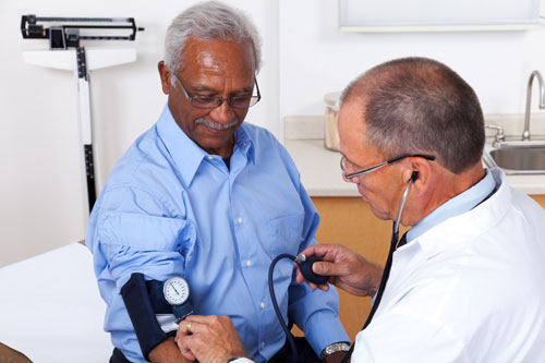 doctor administering a blood pressure test