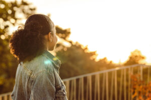 woman looking at sunrise