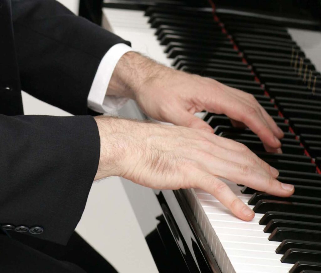 Hands playing piano