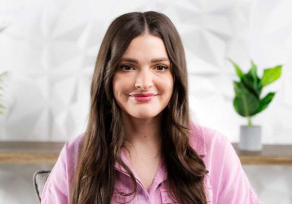 Smiling young woman with long brown hair