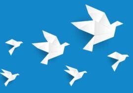 six white origami birds on a blue background